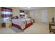 Primary bedroom with king-size bed and sitting area at 3643 Southland Ne Dr, Buford, GA 30519