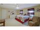 Primary bedroom with king-size bed and sitting chair at 3643 Southland Ne Dr, Buford, GA 30519