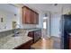 Granite countertops, stainless steel appliances, and ample cabinetry in this well-equipped kitchen at 3643 Southland Ne Dr, Buford, GA 30519