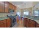 Modern kitchen with granite countertops and stainless steel appliances at 3643 Southland Ne Dr, Buford, GA 30519