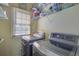 Laundry room with washer, dryer, and shelving at 3643 Southland Ne Dr, Buford, GA 30519