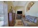 Relaxing sitting area with a fireplace and large screen TV at 3643 Southland Ne Dr, Buford, GA 30519
