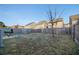 Large fenced backyard with grassy area and a tree at 529 Dasheill Ln, Atlanta, GA 30349
