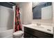 Bathroom with a shower featuring a colorful shower curtain and dark vanity at 529 Dasheill Ln, Atlanta, GA 30349