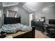 Large bedroom with a dark wood frame bed and window at 529 Dasheill Ln, Atlanta, GA 30349