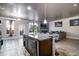 Open-concept kitchen with a large island, granite countertops, and modern appliances at 529 Dasheill Ln, Atlanta, GA 30349