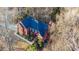 Two-story house, dark roof, surrounded by trees at 7715 Bold Springs Xing, Cumming, GA 30041