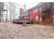 Large backyard with red brick home and deck at 7715 Bold Springs Xing, Cumming, GA 30041