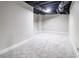 Unfinished basement with carpeted floor at 7715 Bold Springs Xing, Cumming, GA 30041