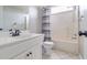 Clean bathroom with shower/tub combo, toilet and vanity at 7715 Bold Springs Xing, Cumming, GA 30041