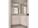 Corner bathroom vanity with sink and mirror at 7715 Bold Springs Xing, Cumming, GA 30041