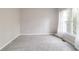 Bright bedroom with neutral walls and carpet at 7715 Bold Springs Xing, Cumming, GA 30041