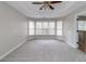 Bright bedroom with carpeted floors and large windows at 7715 Bold Springs Xing, Cumming, GA 30041