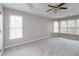 Spacious bedroom with carpeted floors and large windows at 7715 Bold Springs Xing, Cumming, GA 30041
