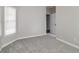Spacious bedroom with neutral decor and carpet flooring at 7715 Bold Springs Xing, Cumming, GA 30041