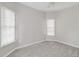 Bright bedroom with neutral walls and carpet flooring at 7715 Bold Springs Xing, Cumming, GA 30041