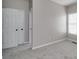 Well-lit bedroom with neutral walls and carpet flooring at 7715 Bold Springs Xing, Cumming, GA 30041
