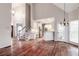 Open breakfast area with hardwood floors and kitchen access at 7715 Bold Springs Xing, Cumming, GA 30041