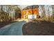 Long curved driveway leading to a two-car garage at 7715 Bold Springs Xing, Cumming, GA 30041
