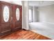 Formal entry with hardwood floors and view to dining room at 7715 Bold Springs Xing, Cumming, GA 30041