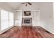 Spacious Gathering room featuring a stone fireplace and built-in shelving at 7715 Bold Springs Xing, Cumming, GA 30041