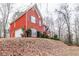 Two story red brick house with attached garage at 7715 Bold Springs Xing, Cumming, GA 30041