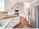 Open kitchen boasts granite countertops and stainless steel appliances at 7715 Bold Springs Xing, Cumming, GA 30041