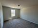 View of an empty bedroom featuring carpet and a window at 222 Depot Landing Rd # 58, Auburn, GA 30011