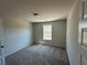 View of an empty bedroom featuring carpet and a window at 222 Depot Landing Rd # 58, Auburn, GA 30011