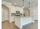 Modern kitchen with white cabinets and granite island at 222 Depot Landing Rd # 58, Auburn, GA 30011