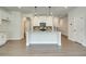 Modern kitchen with white cabinets and granite island at 222 Depot Landing Rd # 58, Auburn, GA 30011