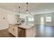 Open concept kitchen island with granite and stainless steel appliances at 222 Depot Landing Rd # 58, Auburn, GA 30011