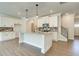 Modern kitchen with white cabinets and granite island at 222 Depot Landing Rd # 58, Auburn, GA 30011