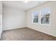 Bright bedroom with neutral walls and carpet at 2799 Porches Ln, Dacula, GA 30019