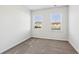 Bright bedroom with neutral carpeting and two windows at 2799 Porches Ln, Dacula, GA 30019