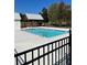Inviting community pool with a large deck and pergola at 2799 Porches Ln, Dacula, GA 30019