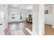 Bright entryway with hardwood floors and view into dining area at 2799 Porches Ln, Dacula, GA 30019