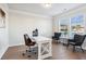 Home office with hardwood floors, desk and two armchairs at 2799 Porches Ln, Dacula, GA 30019