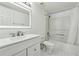 Bathroom with white vanity, bathtub and updated fixtures at 795 Hammond Dr # 1407, Atlanta, GA 30328