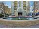 Attractive building exterior with fountain and landscaping at 795 Hammond Dr # 1407, Atlanta, GA 30328