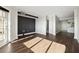 Sunlit living room featuring hardwood floors and access to balcony at 795 Hammond Dr # 1407, Atlanta, GA 30328