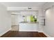 Living room with hardwood floors and kitchen bar at 795 Hammond Dr # 1407, Atlanta, GA 30328