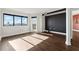 Sunlit living room featuring hardwood floors and city views at 795 Hammond Dr # 1407, Atlanta, GA 30328