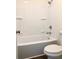 White tub and shower combo with updated fixtures and storage at 195 Ridgecrest Way, Stockbridge, GA 30281
