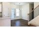 Dining area with new floors, windows for natural light, and modern light fixture at 195 Ridgecrest Way, Stockbridge, GA 30281