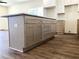 Kitchen island with plenty of storage and new floors throughout the kitchen and living area at 195 Ridgecrest Way, Stockbridge, GA 30281