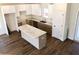 Open kitchen with island, stainless steel appliances and view of the dining area at 195 Ridgecrest Way, Stockbridge, GA 30281