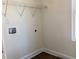 Bright laundry room features wood-look flooring and utility connections at 195 Ridgecrest Way, Stockbridge, GA 30281