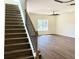Spacious living room with lots of natural light, fan and staircase at 195 Ridgecrest Way, Stockbridge, GA 30281