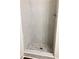 Modern tiled shower with a pebble floor and a chrome shower head at 195 Ridgecrest Way, Stockbridge, GA 30281